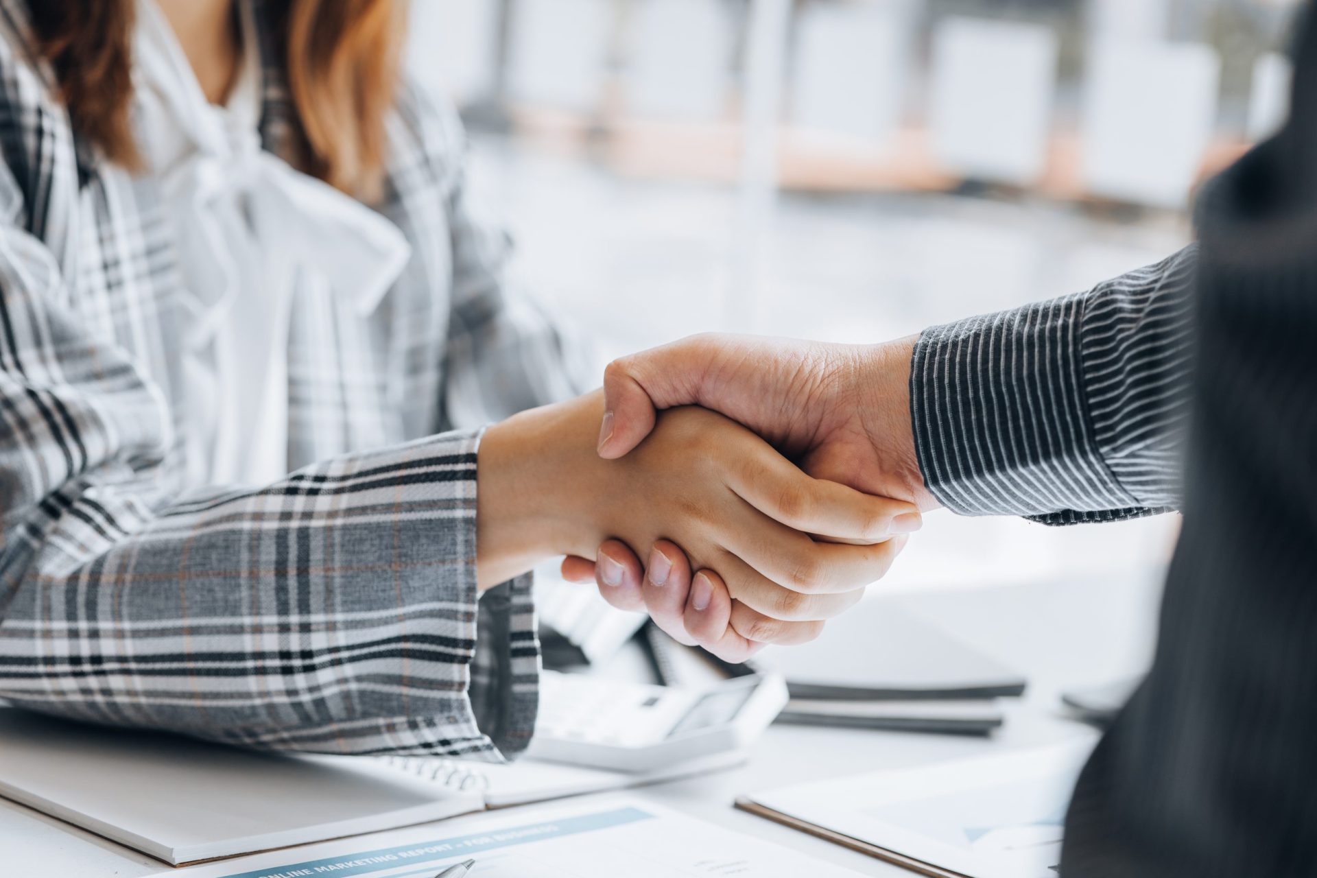 client and personal injury attorney are shaking their hands client and personal injury lawyer are shaking their hands